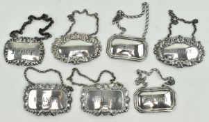 COLLECTION OF SEVEN HALLMARKED SILVER BOTTLE TAGS / WINE LABELS