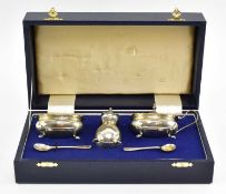 A CASED HALLMARKED SILVER THREE-PIECESCRUET SET