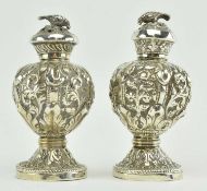 PAIR OF SILVER PEPPER SHAKERS DECORATED WITH FOLIAGE & BIRD FINIAL