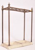 PRIVATE COLLECTION OF DERREN BROWN - EARLY 20TH CENTURY BRASS & CAST IRON UMBRELLA STICK STAND