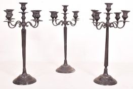 SET OF THREE LARGE SILVER-TONED CANDELABRAS