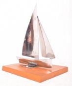 VINTAGE CHROME SAILING BOAT YACHT SCULPTURE RAISED ON WOODEN MOUNT
