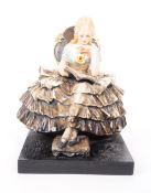 GUIDO CACCIAPUOTI - ITALY (1892 - 1953) SEATED CRINOLINE LADY FIGURE