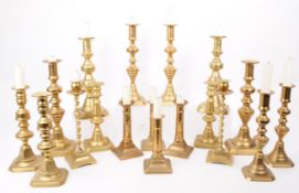 LARGE COLLECTION OF 20TH CENTURY BRASS CANDLESTICKS