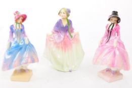 ROYAL DOULTON - THREE EARLY TO MID 20TH CENTURY PORCELAIN LADY FIGURES