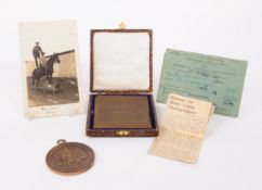 TWO EARLY 20TH CENTURY BRONZE MEDALS ALONGSIDE PHOTOGRAPH AND CONTRIBUTORS CARD