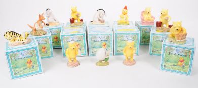 ROYAL DOULTON - COLLECTION OF TWELVE WINNIE THE POOH CHINA FIGURES