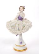 VOLKSTEDT RUDOLSTADT - 20TH CENTURY GERMAN PORCELAIN LADY FIGURINE