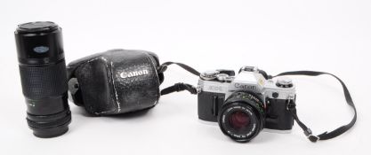 CANON AE-1 - LATE 20TH CENTURY FILM CAMERA AND TWO LENSES