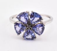HALLMARKED 9CT WHITE GOLD TANZANITE & BLUE DIAMOND FLOWER RING