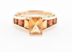 HALLMARKED 9CT GOLD CITRINE & GARNET SEVEN STONE RING