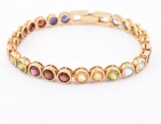 18CT GOLD GEM SET TENNIS BRACELET