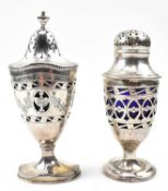 TWO HALLMARKED SILVER BLUE GLASS LINED PEPPERETTES