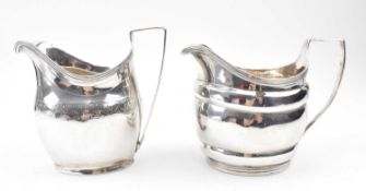 NEAR MATCHED PAIR OF GEORGE III HALLMARKED SILVER CREAMER JUGS