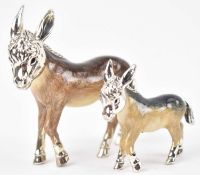 A GRADUATED PAIR OF HALLMARKED 925 SILVER AND ENAMEL DONKEYS BY SATURNO