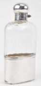 AN EDWARDIAN HALLMARKED SILVER MOUNTED CUT GLASS HIP FLASK