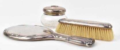 A GEORGE V HALLMARKED SILVER THREE-PIECES DRESSING TABLE SET