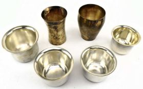 A COLLECTION OF TWO INDIAN SILVER TUMBLERS & FOUR GRADUATED BOWLS