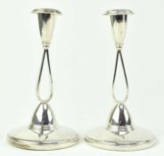 A PAIR OF HALLMARKED SILVER CANDLESTICKS