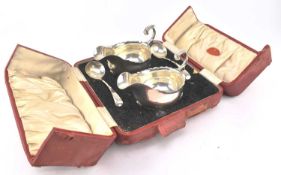 A GEORGE V HALLMARKED SILVER 4-PIECE GRAVY / SAUCE BOAT SUITE