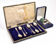 A PAIR OF HALLMARKED SILVER STUB CANDLESTICKS & A CASED SET OF SIX SILVER SPOONS