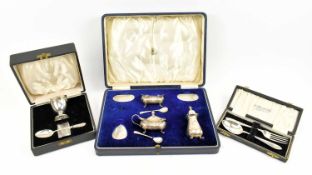 TWO CASED OF HALLMARKED SILVER CHRISTENING GIFT SETS & A CRUET SET