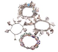 FOUR SILVER CHARM BRACELETS