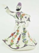 VINTAGE CERAMIC FIGURINE OF A WHIRLING DERVISH, HAND PAINTED
