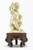 19TH CENTURY BISQUE FIGURINE CANDLE HOLDER RAISED ON WOODEN SOCLE BASE