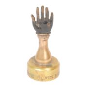 ST JOHNS BLACK HAND GANG - EARLY 20TH CENTURY BRASS PAPERWEIGHT