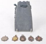 COLLECTION OF 1920S SILVER FOOTBALL MEDALS
