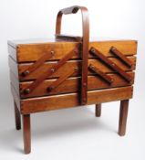VINTAGE 20TH CENTURY CANTILEVER SEWING BOX RAISED ON FOUR SQUARE LEGS