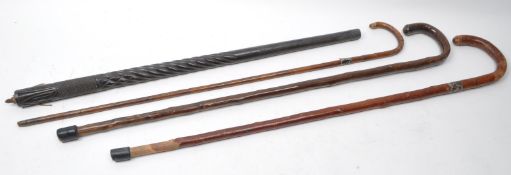 FOUR LATE 19TH / EARLY 20TH CENTURY WALKING STICKS