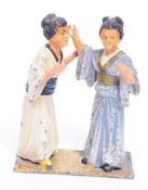 TWO EARLY 20TH CENTURY SPELTER / LEAD FIGURES OF GEISHA LADIES