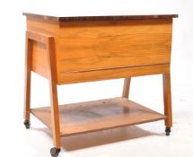 BRITISH MODERN DESIGN - A 20TH CENTURY WALNUT SEWING TROLLEY