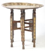 EARLY 20TH CENTURY MIDDLE EASTERN BRASS TRAY TOP FOLDING TABLE