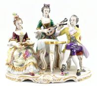 20TH CENTURY GILT PORCELAIN FIGURAL SCENE IN ROCOCO STYLE