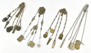 COLLECTION OF FOUR EARLY 20TH CENTURY METAL CHATELAINES