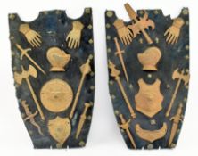 PAIR OF 19TH CENTURY CAST IRON KNIGHTS' ATTRIBUTES SHIELDS
