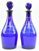 PAIR OF 19TH CENTURY BRISTOL GLASS BLUE RUM & HOLLANDS DECANTERS