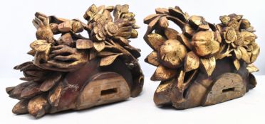 PAIR OF HEAVILY CARVED AND GILT WOOD FLORAL WALL DECORATIONS