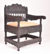 LATE 17TH CENTURY COROMANDEL COAST ANGLO INDIAN EBONY ARMCHAIR