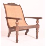 EARLY 20TH CENTURY MAHOGANY FRAMED RATTAN PLANTATION CHAIR