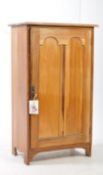 EARLY 20TH CENTURY PINE CUPBOARD WITH FIELDED ARCHES TO DOOR