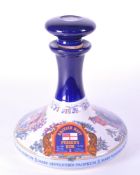 WADE - 20TH CENTURY PORCELAIN DECANTER OF BRITISH NAVY PUSSER'S RUM
