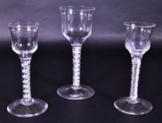 THREE 18TH CENTURY GEORGE III DOUBLE AIR TWIST STEM DRINKING GLASSES