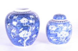 TWO EARLY 20TH CENTURY PRUNUS BLUE & WHITE GINGER JARS
