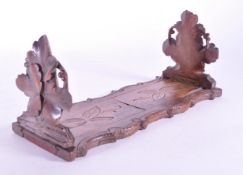 LATE 19TH CENTURY BLACK FOREST GERMAN BOOK SLIDE