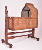 HEAL & SON, LONDON - VICTORIAN CANE RATTAN & MAHOGANY ROCKING COT CRIB