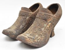 PAIR OF 19TH CENTURY CAST IRON BELIEVED COALBROOKDALE HEELED SHOES / PLANTERS